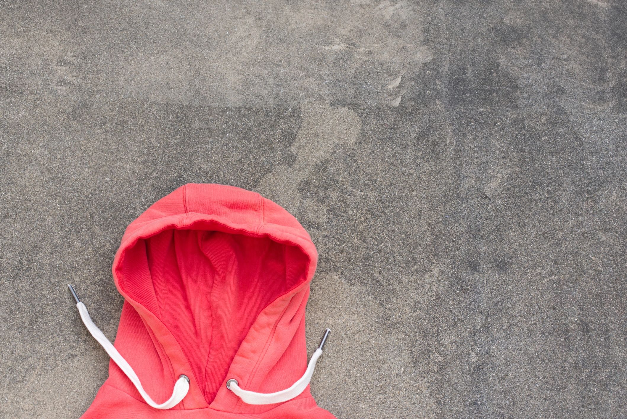 Red hoodie detail on fabric