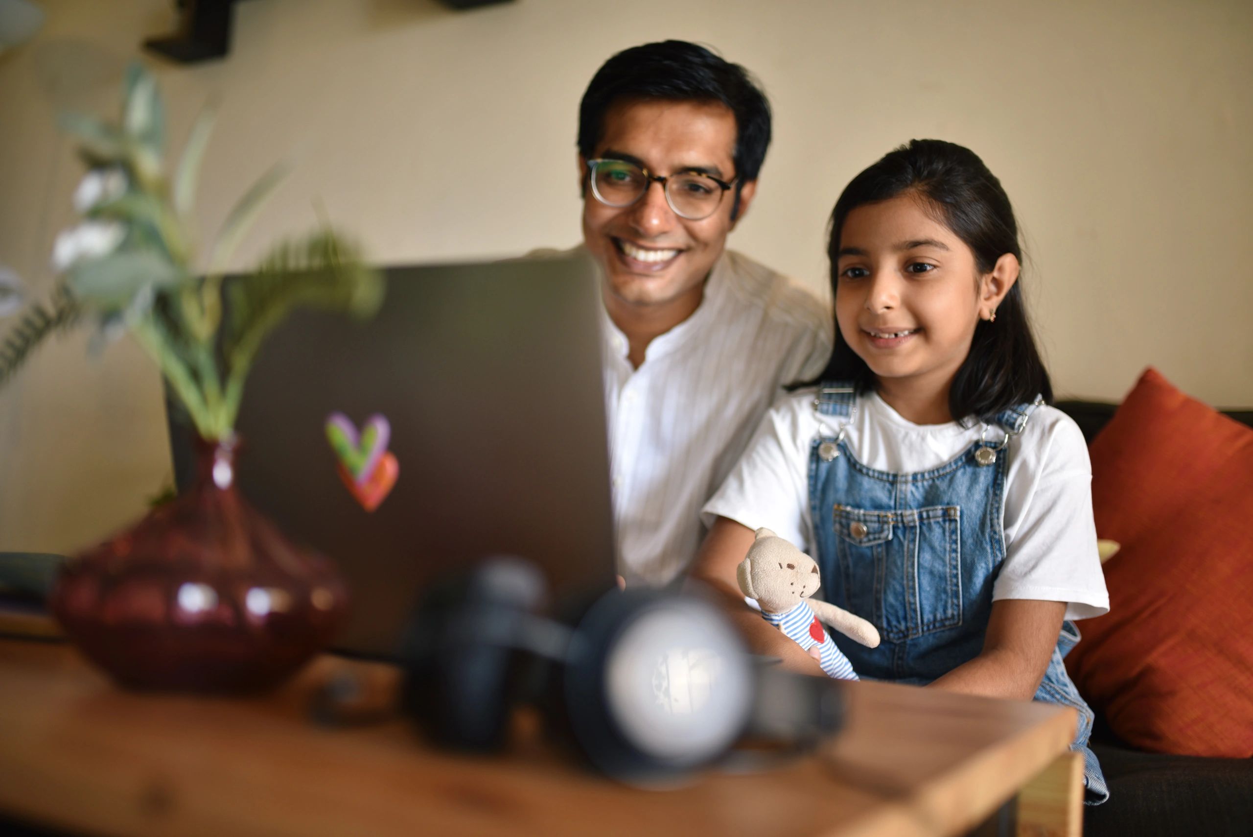 Parent and child shopping online together, illustrating safe and responsible use
