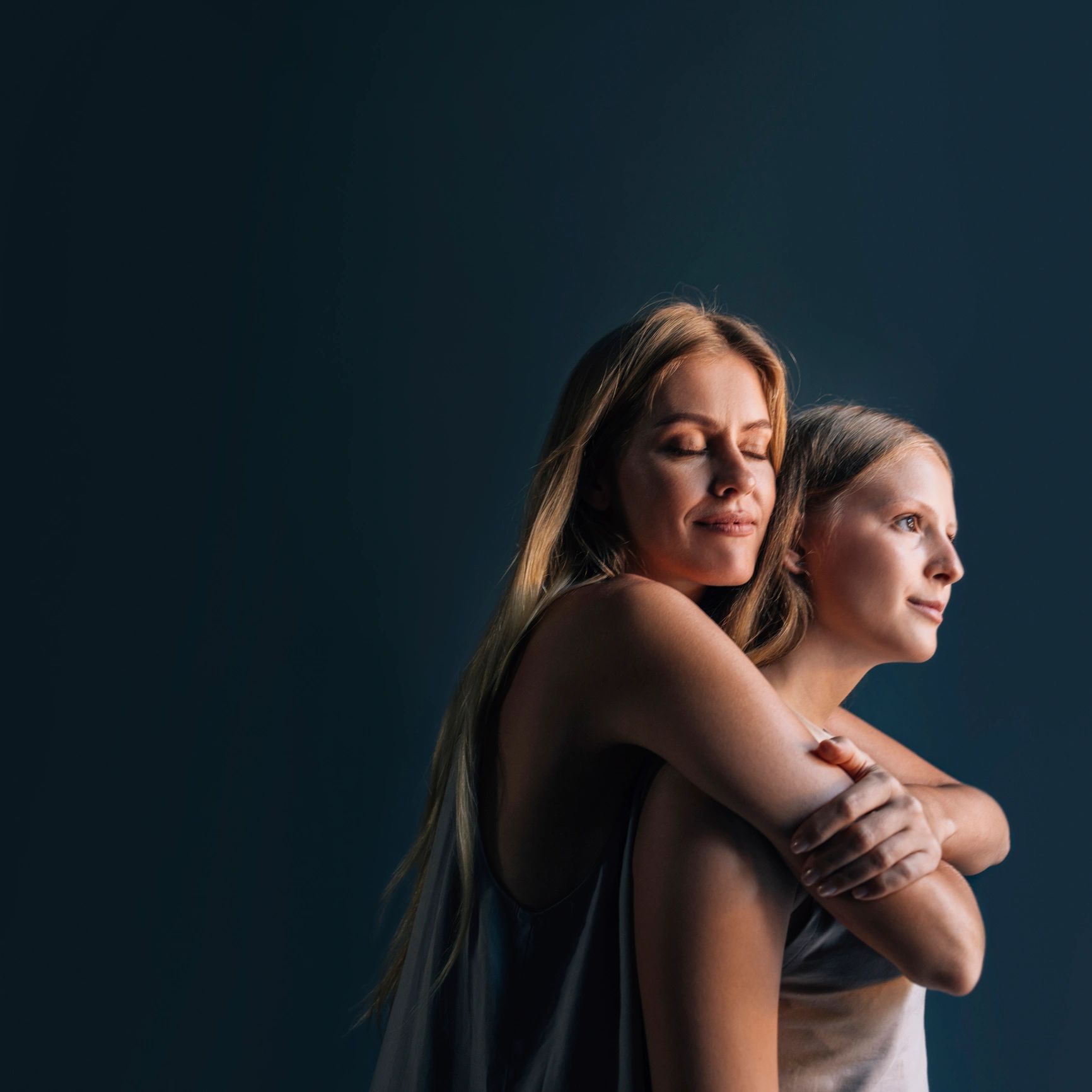 Mother and daughter hugging portrait