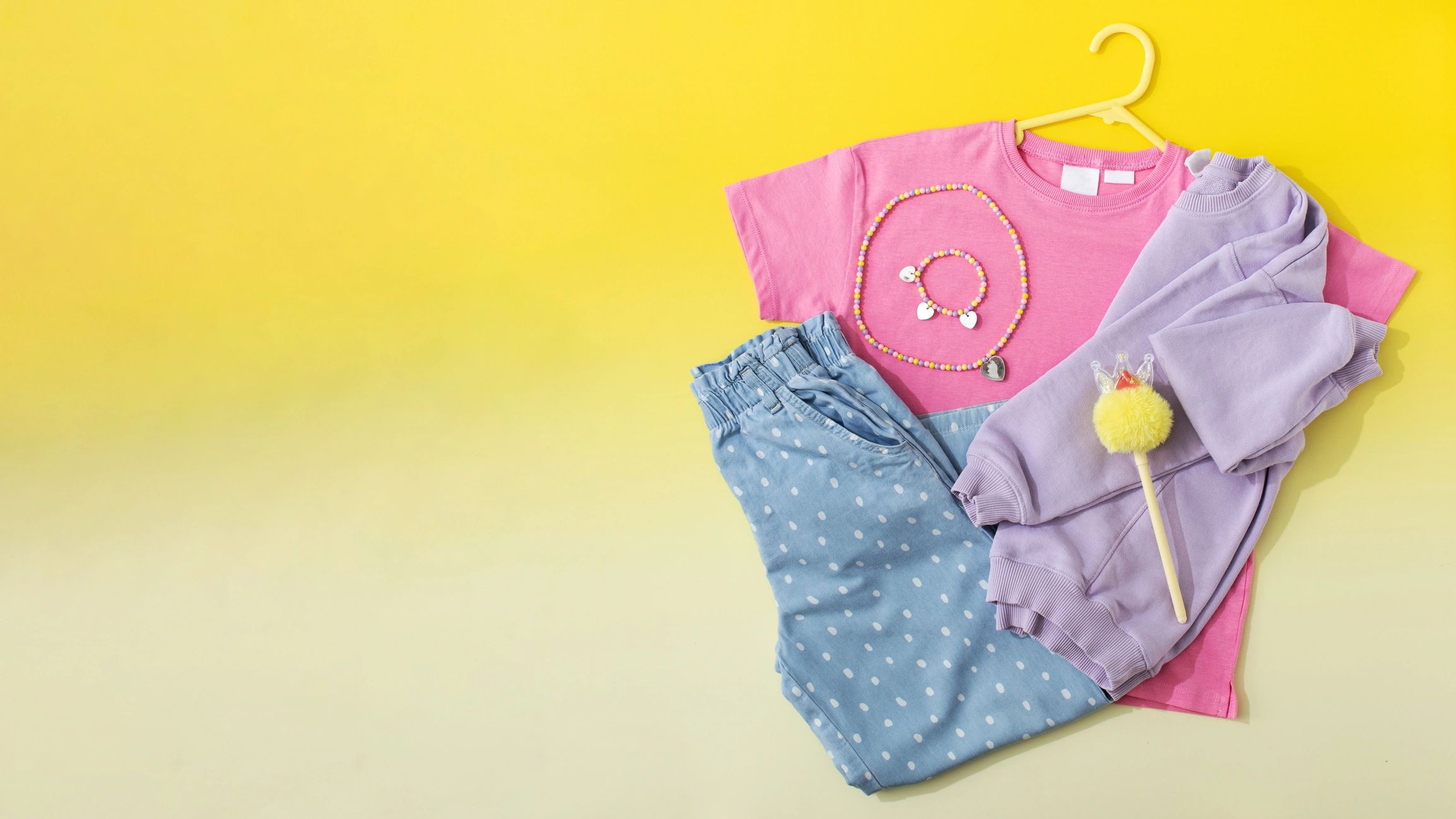 Colorful kids clothing flat lay with copy space