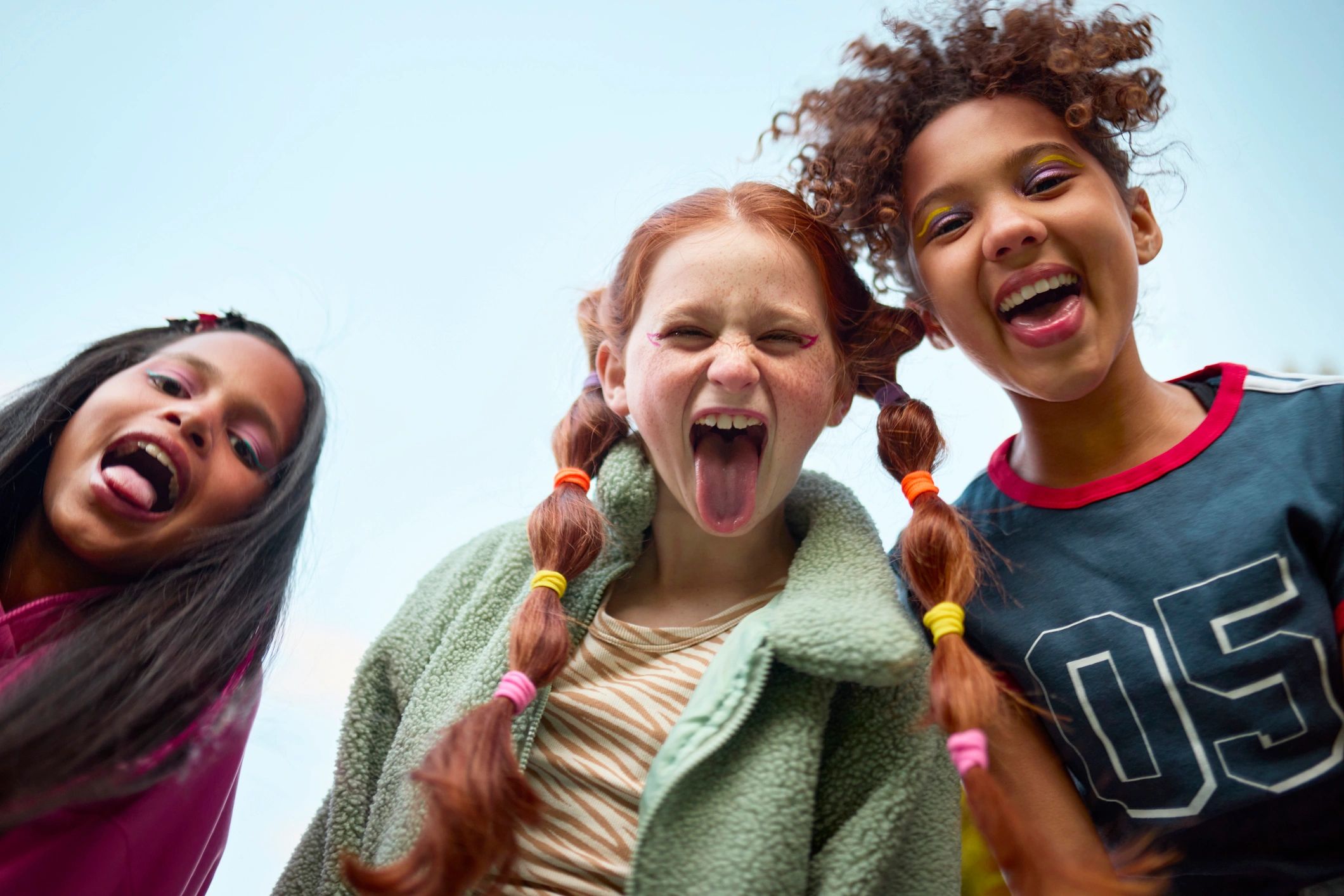 Happy kids posing playfully outdoors